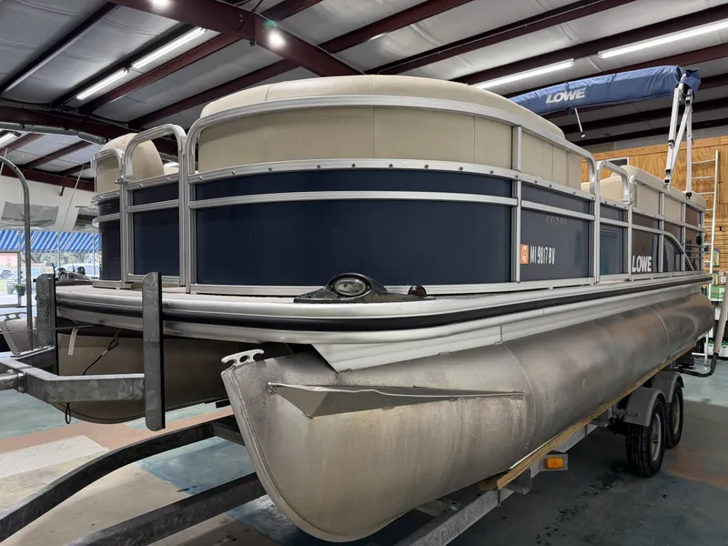 Slide: The Image of 2014 Lowe SS 210 pontoon boat in warehouse on trailer. - 5