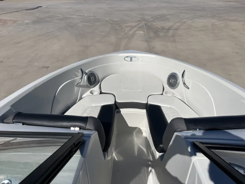 Slide: The Image of Interior view of a 2016 Tahoe 550 TS boat with seating area. - 12