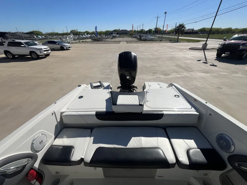 Slide: The Image of Rear view of a 2016 Tahoe 550 TS boat on a parking lot. - 19