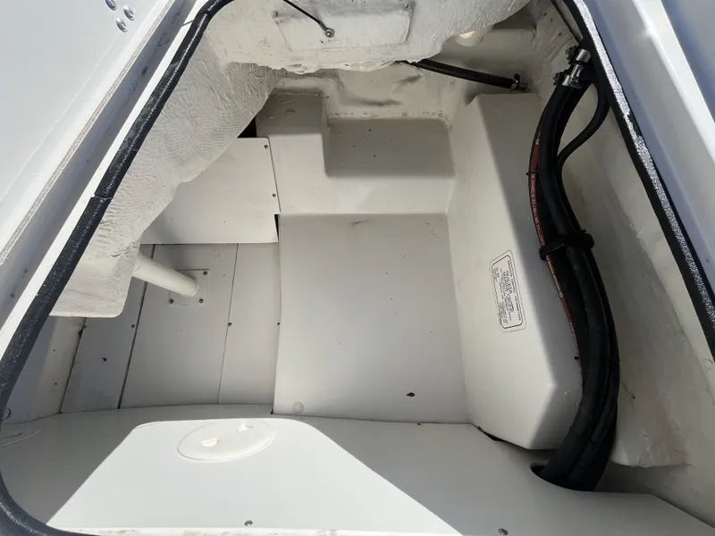 Slide: The Image of Interior of a 2016 Tahoe 550 TS boat, white structure and cables. - 21