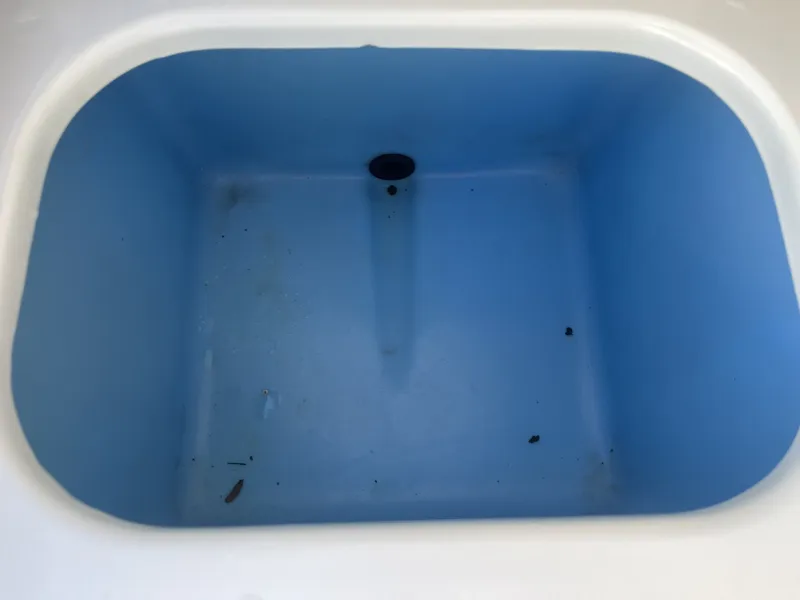 Slide: The Image of Empty blue compartment in 2016 Tahoe 550 TS boat. - 23