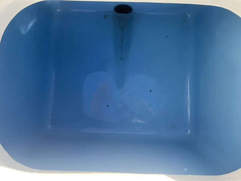 Slide: The Image of Blue compartment in 2016 Tahoe 550 TS boat. - 24