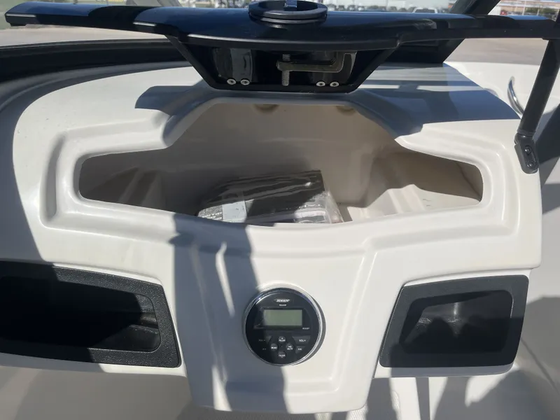 Slide: The Image of Interior view of a 2016 Tahoe 550 TS boat with control console. - 28