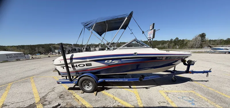 Slide: The Image of 2013 TAHOE Q5i boat parked on trailer outdoors. - 6