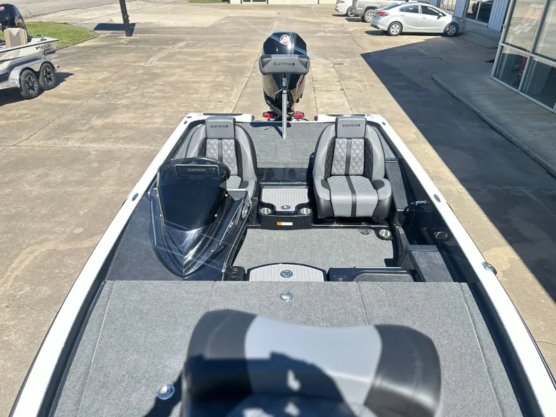 Slide: The Image of 2027 Caymas CX 201 PRO boat with gray seats and Garmin equipment. - 12