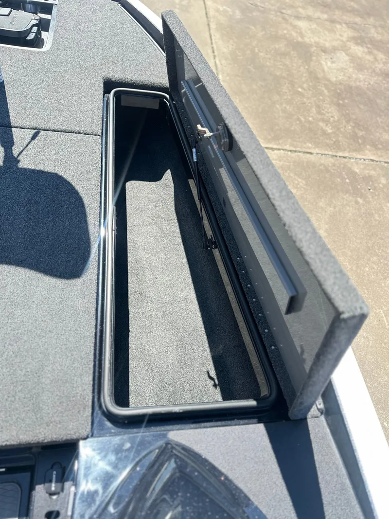 Slide: The Image of Open storage compartment in Caymas CX 201 PRO boat, year 2027. - 14