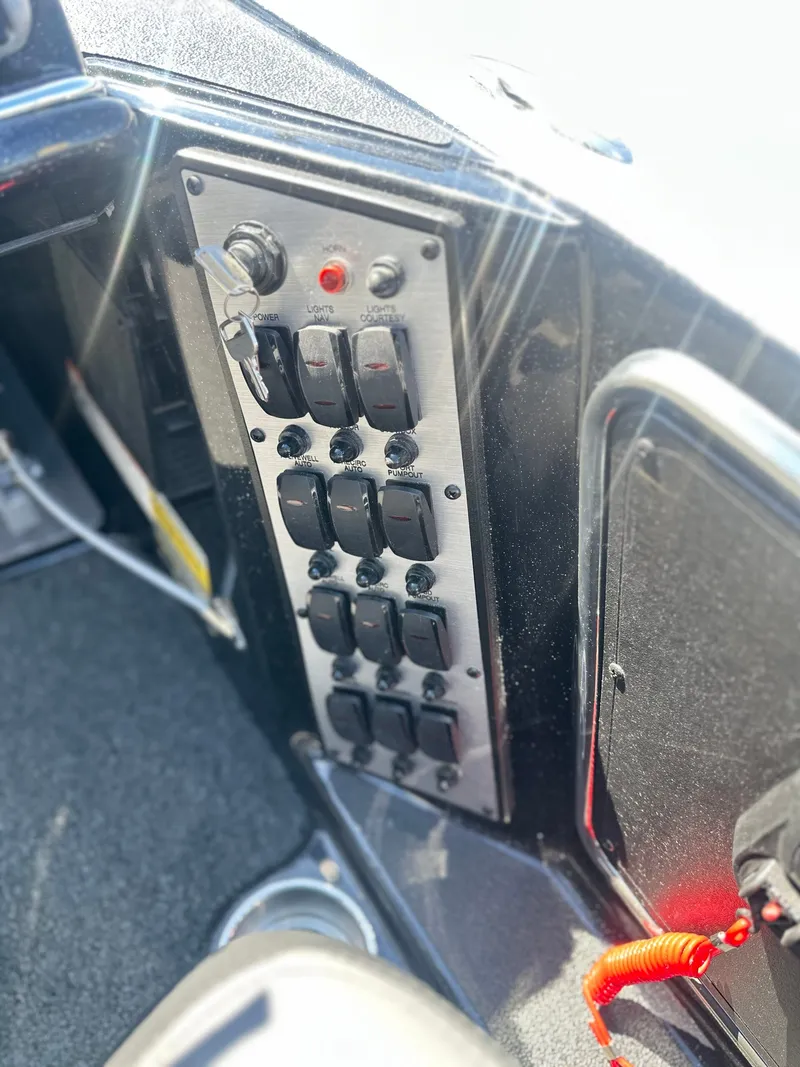 Slide: The Image of Control panel of 2027 Caymas CX 201 PRO with toggle switches. - 9