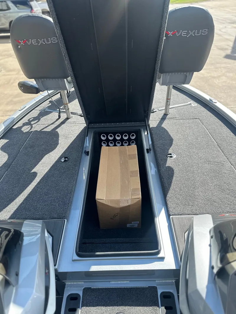 Slide: The Image of Vexus AVX 1985s 2026 boat with open storage compartment and box. - 12