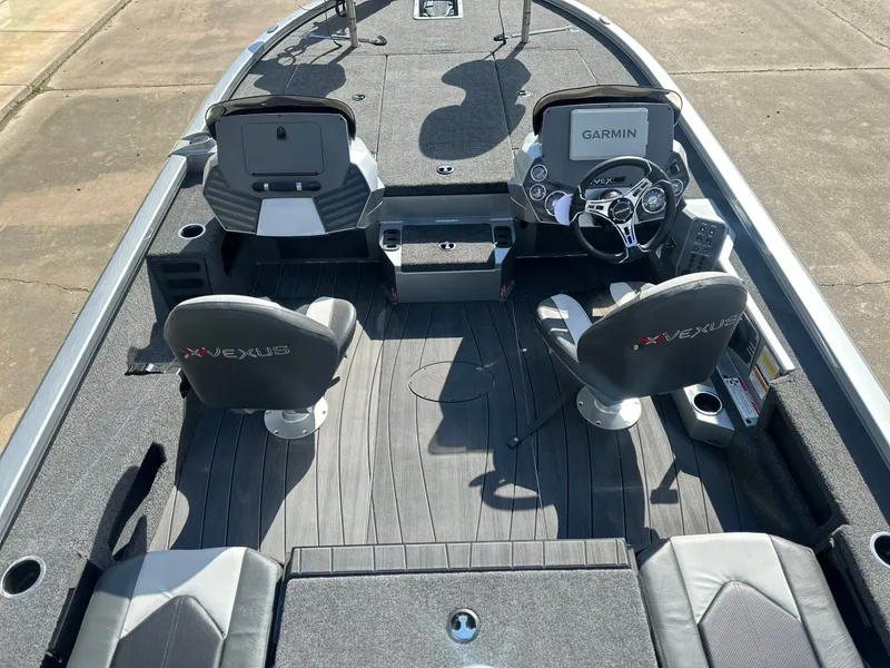 Slide: The Image of Interior of Vexus AVX 1985s boat, 2026 model, featuring Garmin controls. - 4