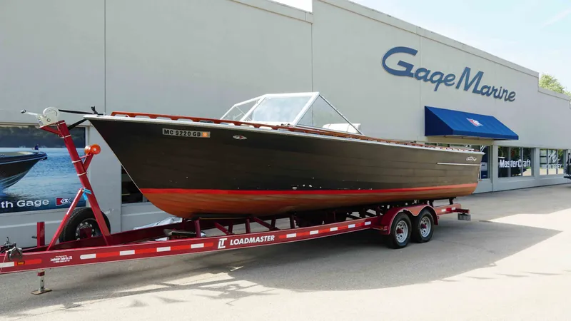 The Image of 1966 Chris-Craft Sea Skiff on trailer outside Gage Marine. - 1