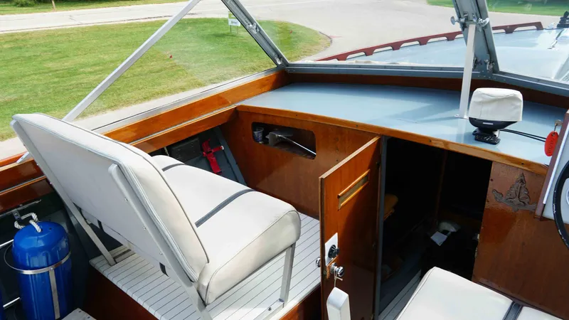 Slide: The Image of Interior of a 1966 Chris-Craft Sea Skiff boat with seating and helm area. - 10