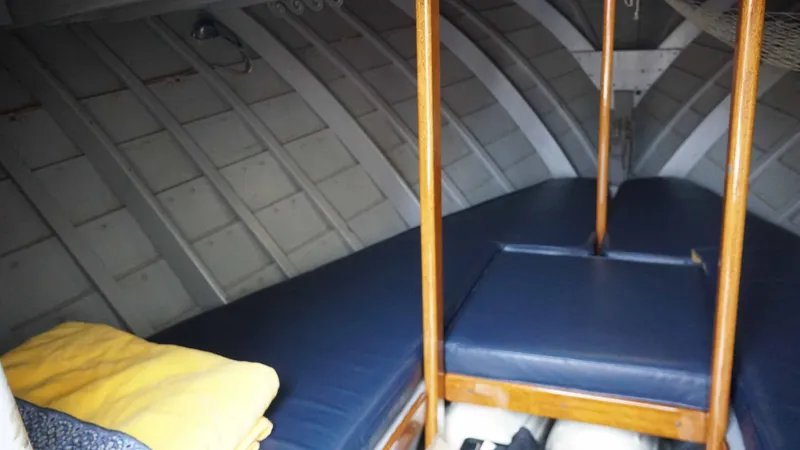 Slide: The Image of Interior of a 1966 Chris-Craft Sea Skiff boat with blue cushions. - 11