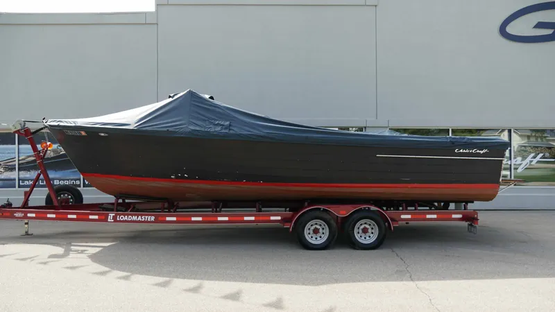 Slide: The Image of 1966 Chris-Craft Sea Skiff on trailer, covered, side view. - 20