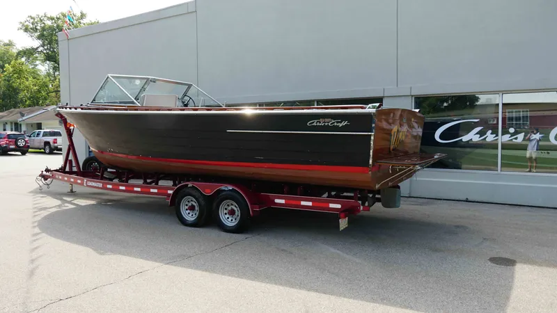 Slide: The Image of 1966 Chris-Craft Sea Skiff on red trailer outside building. - 3