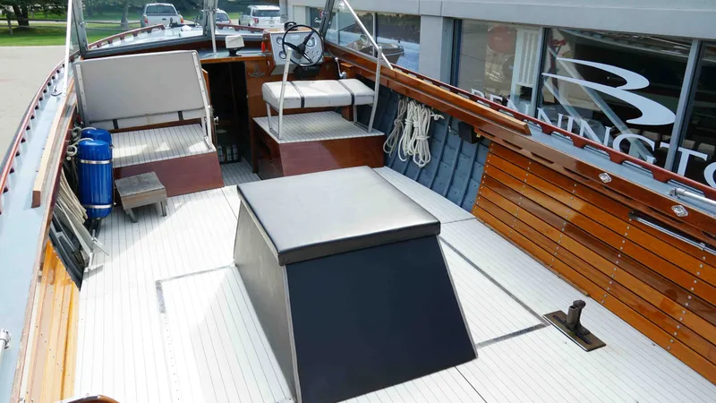 Slide: The Image of Interior view of a 1966 Chris-Craft Sea Skiff boat with wooden features. - 6