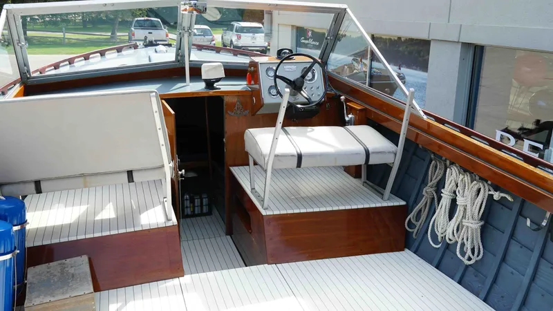 Slide: The Image of Interior of a 1966 Chris-Craft Sea Skiff boat with helm station. - 7