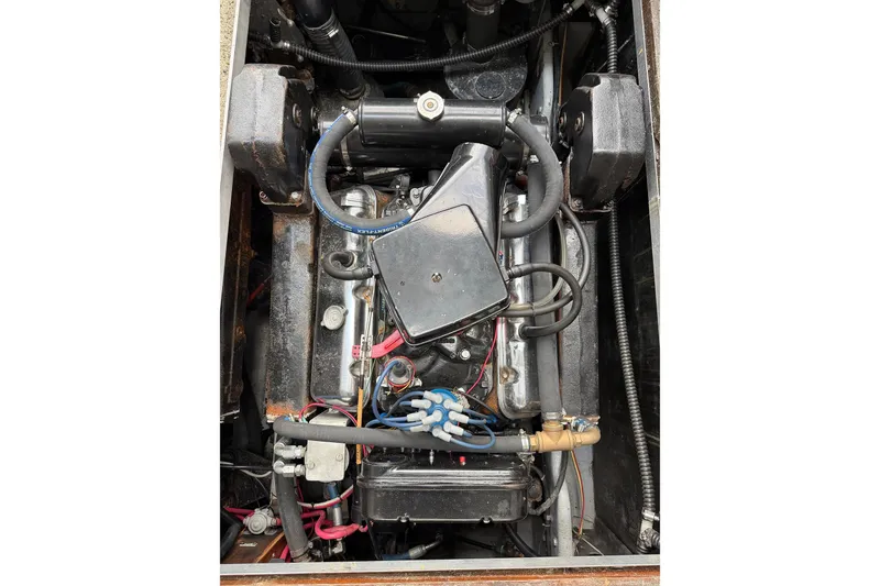Slide: The Image of 1974 Magnum Sportfisher engine compartment with visible components and wiring. - 21