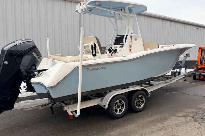 Slide: The Image of 2018 Tidewater 232 SS boat on trailer, featuring a Mercury outboard motor. - 4
