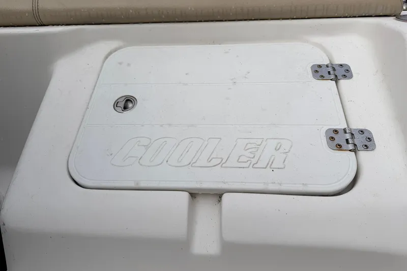Slide: The Image of Cooler compartment on a 2018 Tidewater 232 SS boat, featuring a secure latch. - 9