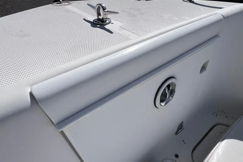 Slide: The Image of 2001 Cobia 194 Center Console boat interior detail with cleat and textured surface. - 18