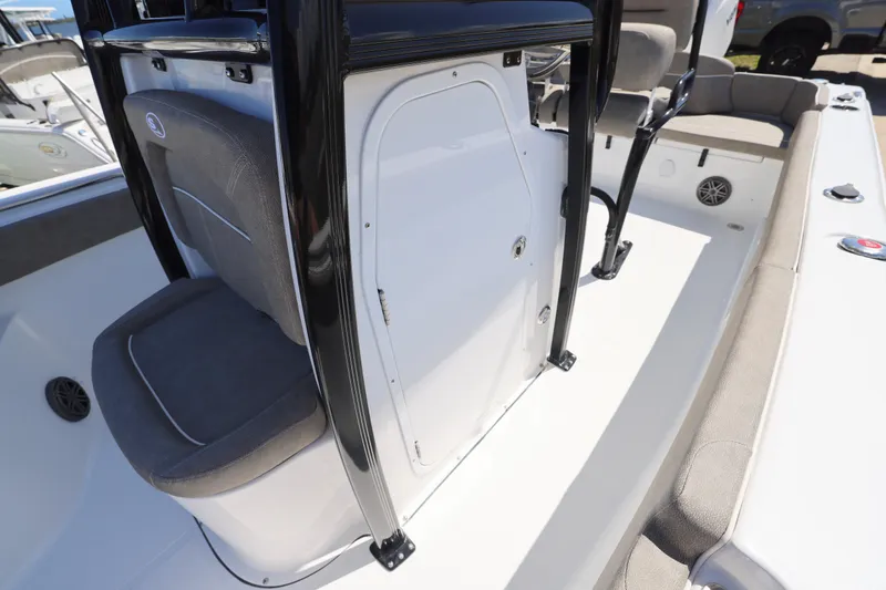 Slide: The Image of 2026 Sea Hunt Ultra 219 boat interior with seating and storage compartment. - 12