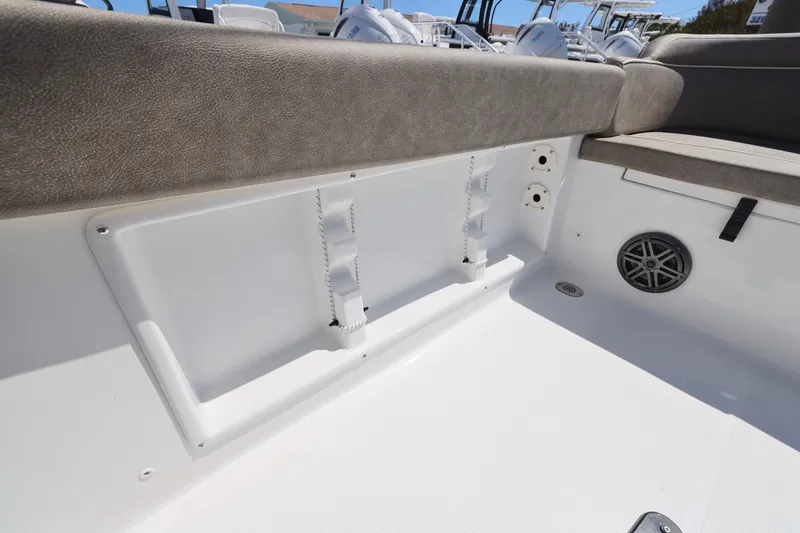 Slide: The Image of 2026 Sea Hunt Ultra 219 boat interior with cushioned seating and speaker. - 15