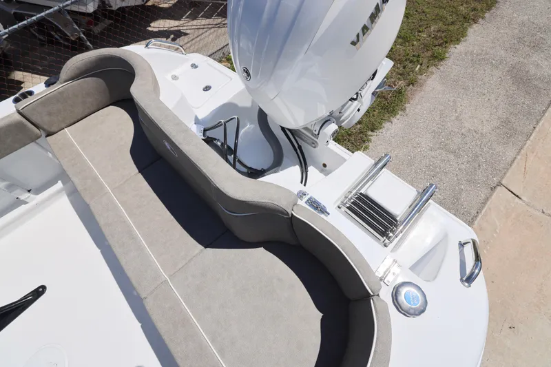 Slide: The Image of 2026 Sea Hunt Ultra 219 boat with Yamaha engine and cushioned seating area. - 17
