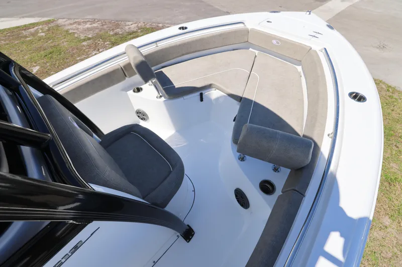 Slide: The Image of 2026 Sea Hunt Ultra 219 boat interior with cushioned seating and sleek design. - 2