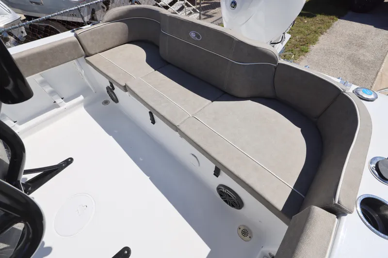 Slide: The Image of 2026 Sea Hunt Ultra 219 boat with spacious cushioned seating area. - 6