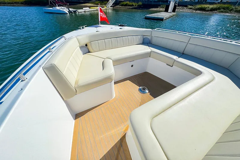 Slide: The Image of Luxurious seating area on 2024 MJM 4 boat with scenic water view. - 12