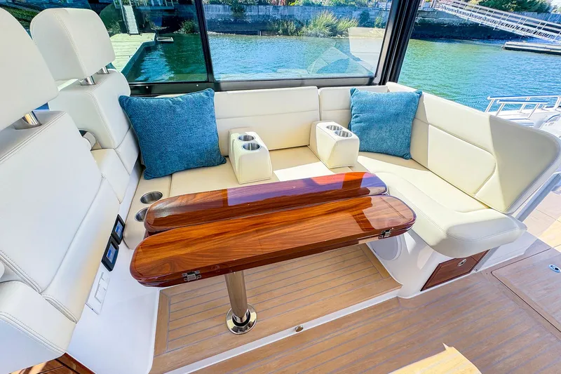Slide: The Image of Luxurious 2024 MJM 4 yacht interior with elegant seating and wooden table. - 18
