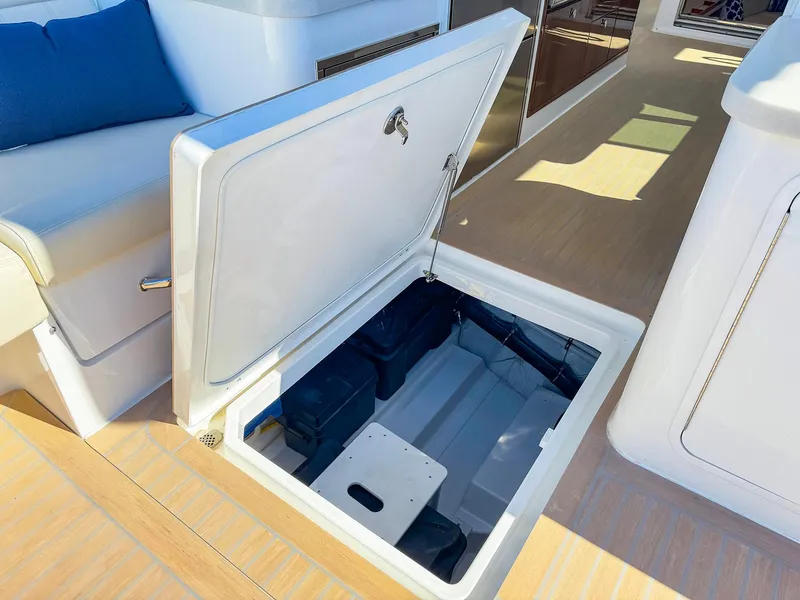 Slide: The Image of 2024 MJM 4 yacht storage compartment with open hatch on deck. - 32