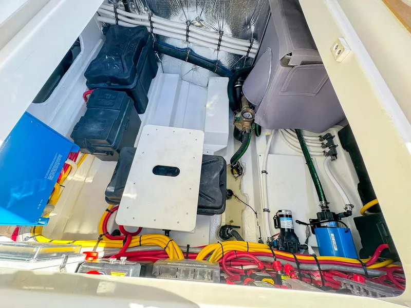 Slide: The Image of 2024 MJM 4 boat engine compartment with organized wiring and components. - 33