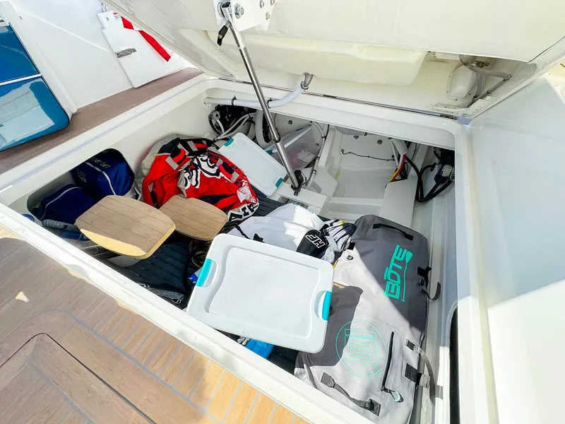 Slide: The Image of Storage compartment of 2024 MJM 4 boat filled with gear and equipment. - 34