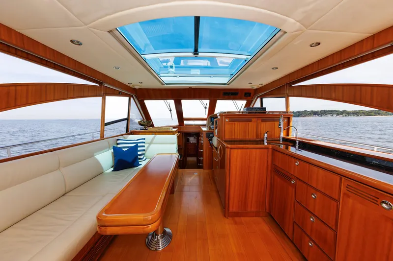 Slide: The Image of Luxurious interior of 2009 Hunt Yachts 52 Express with wood finish and ocean view. - 2