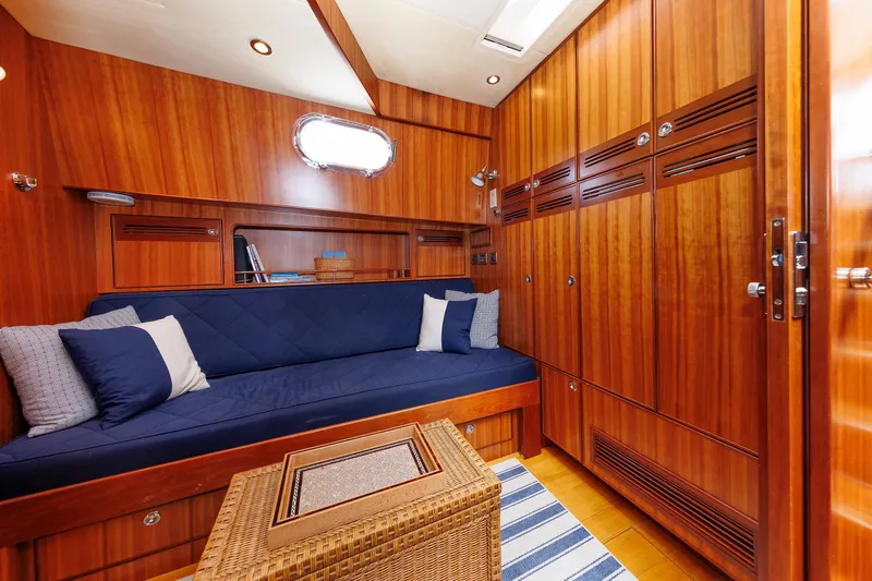 Slide: The Image of Luxurious 2009 Hunt Yachts 52 Express interior with wood paneling and cozy seating area. - 37