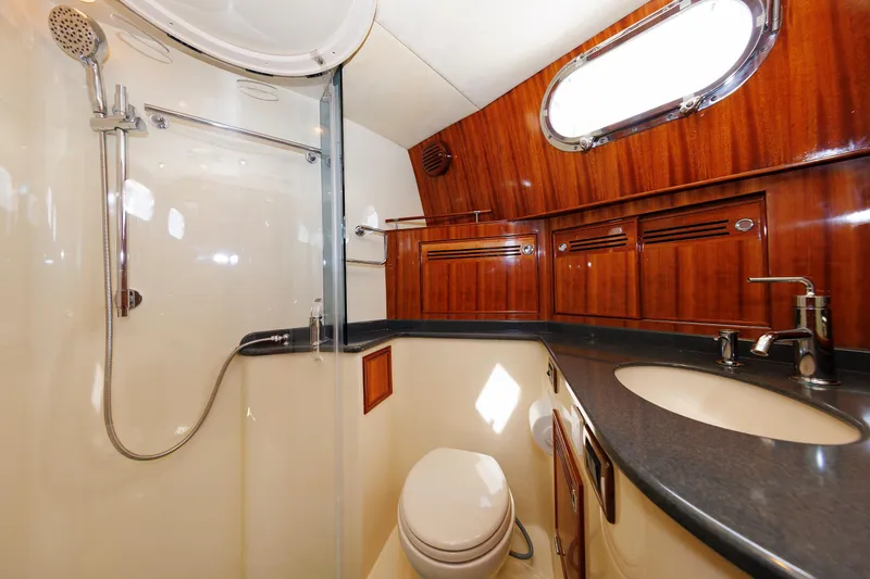 Slide: The Image of Luxurious bathroom in 2009 Hunt Yachts 52 Express with wood accents and modern fixtures. - 39