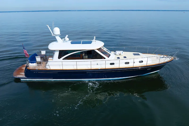 Slide: The Image of 2009 Hunt Yachts 52 Express cruising on calm waters, side view. - 6