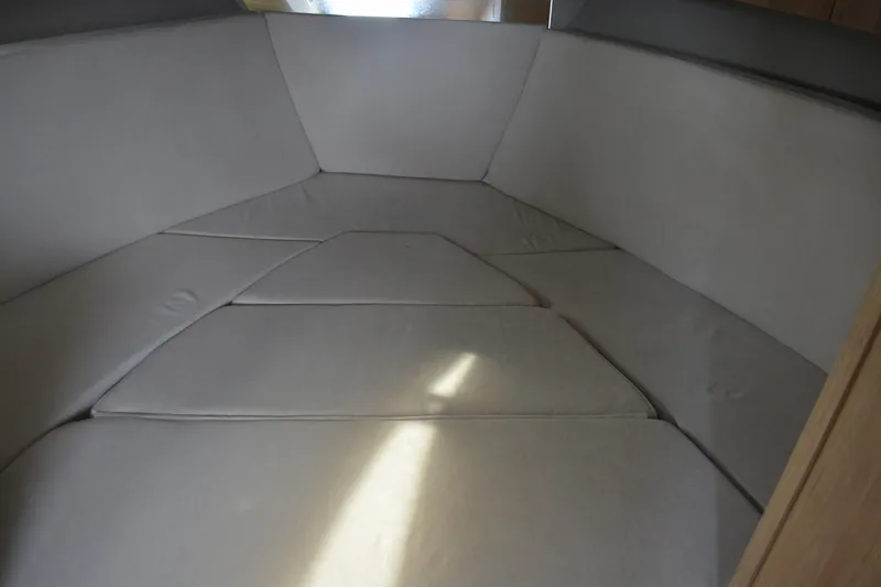 Slide: The Image of Interior cabin of 2026 NX Boats 360 Sport Coupe with cushioned seating. - 12