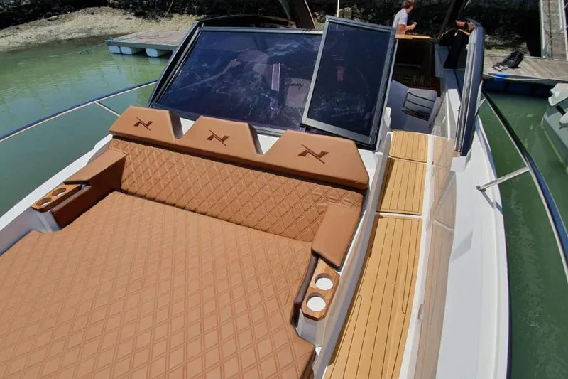 Slide: The Image of Manufacturer Provided Image: 2025 NX Boats 360 Sport Coupe with luxurious tan seating and sleek design. - 5