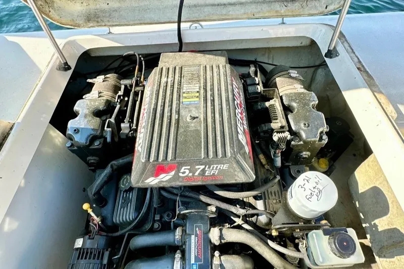 Slide: The Image of Engine compartment of a 2001 Pursuit 2460 Denali boat with 5.7L Mercury EFI engine. - 6
