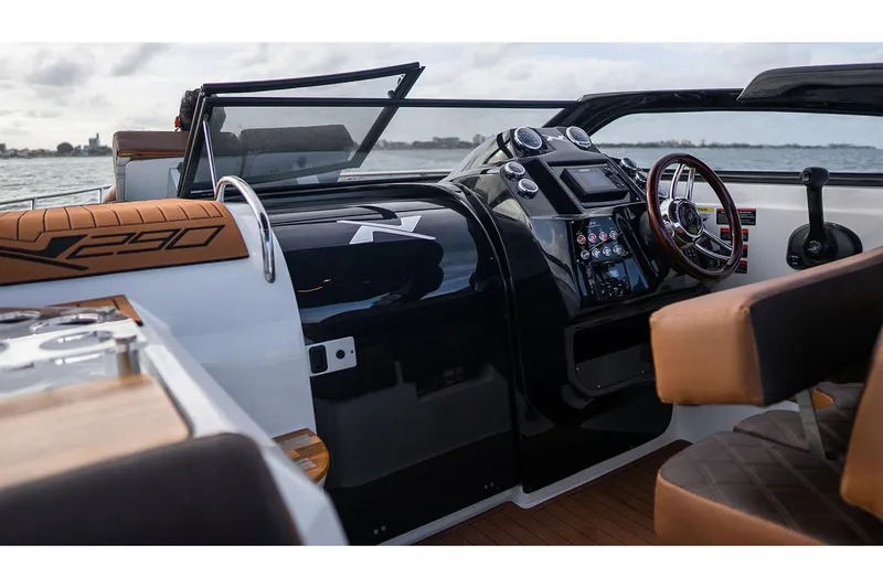 Slide: The Image of Manufacturer Provided Image: 2025 NX Boats 290 Exclusive interior with modern dashboard and steering wheel. - 4