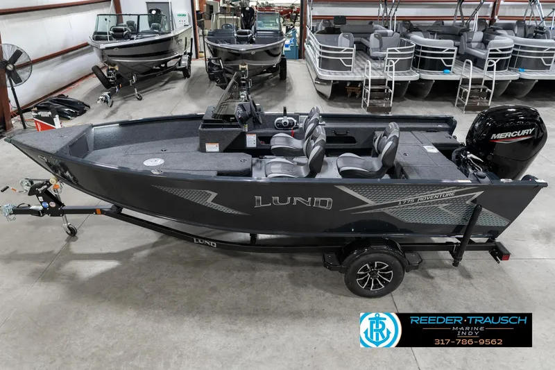 The Image of 2026 Lund 1775 Adventure SS boat in showroom with Mercury engine, trailer attached. - 0