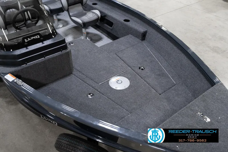 Slide: The Image of 2026 Lund 1775 Adventure SS boat interior with seating and carpeted deck. - 10