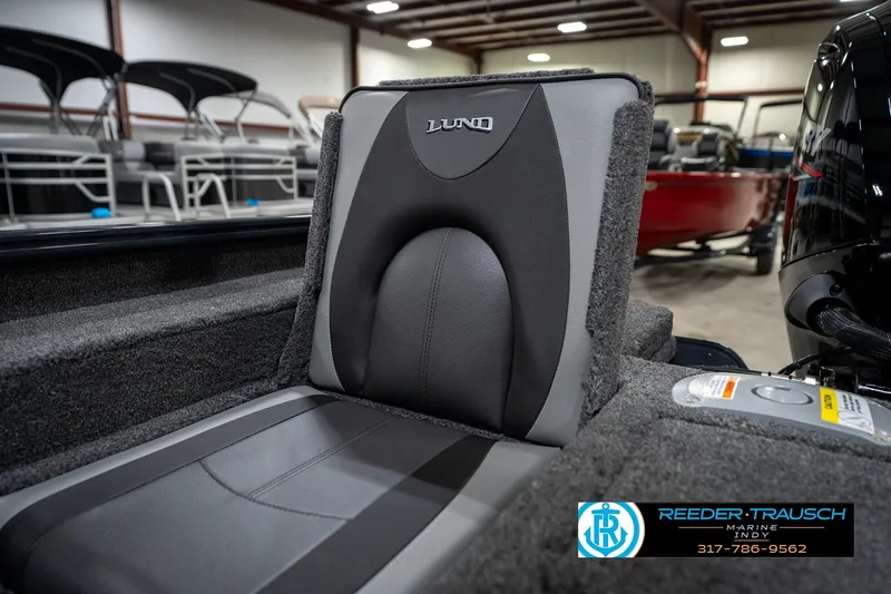 Slide: The Image of 2026 Lund 1775 Adventure SS boat seat in showroom, featuring sleek design and comfortable upholstery. - 36