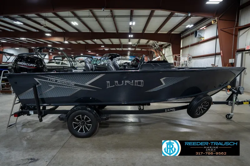 Slide: The Image of 2026 Lund 1775 Adventure SS boat in showroom with Mercury engine. - 4