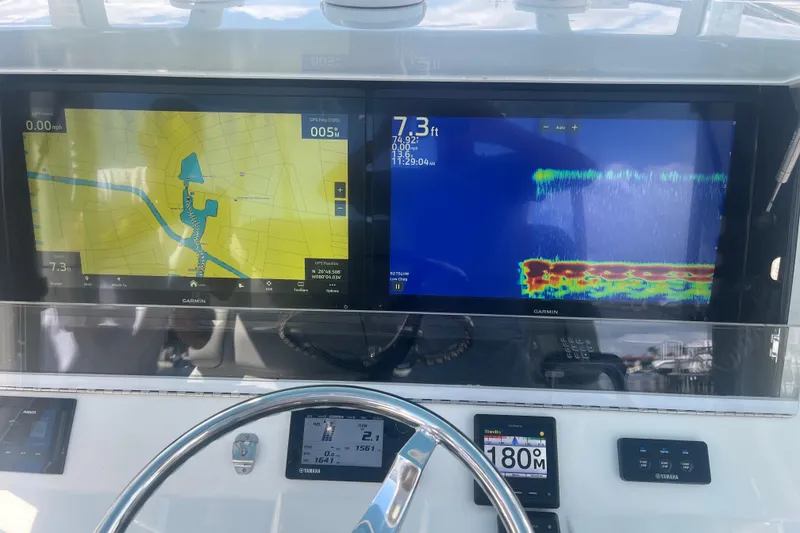 Slide: The Image of Dashboard of 2017 SeaVee 370Z with Garmin navigation and sonar displays. - 13