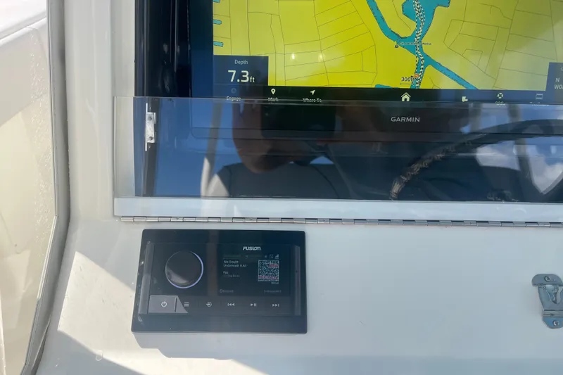 Slide: The Image of Garmin navigation display on 2017 SeaVee 370Z boat dashboard with Fusion audio system. - 14