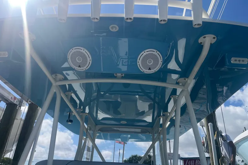 Slide: The Image of 2017 SeaVee 370Z boat with blue hull and speakers, viewed from below. - 17