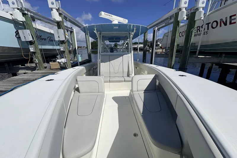 Slide: The Image of 2017 SeaVee 370Z boat interior with seating, docked at marina. - 19